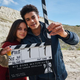 The young stars of His Dark Materials, Dafne Keen and Amir Wilson, pose with a slate as the HBO series' third season begins filming.